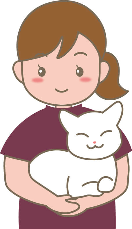 えんじ色のスクラブを着た動物看護師